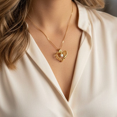 Woman wearing a gold necklace in a softly lit room